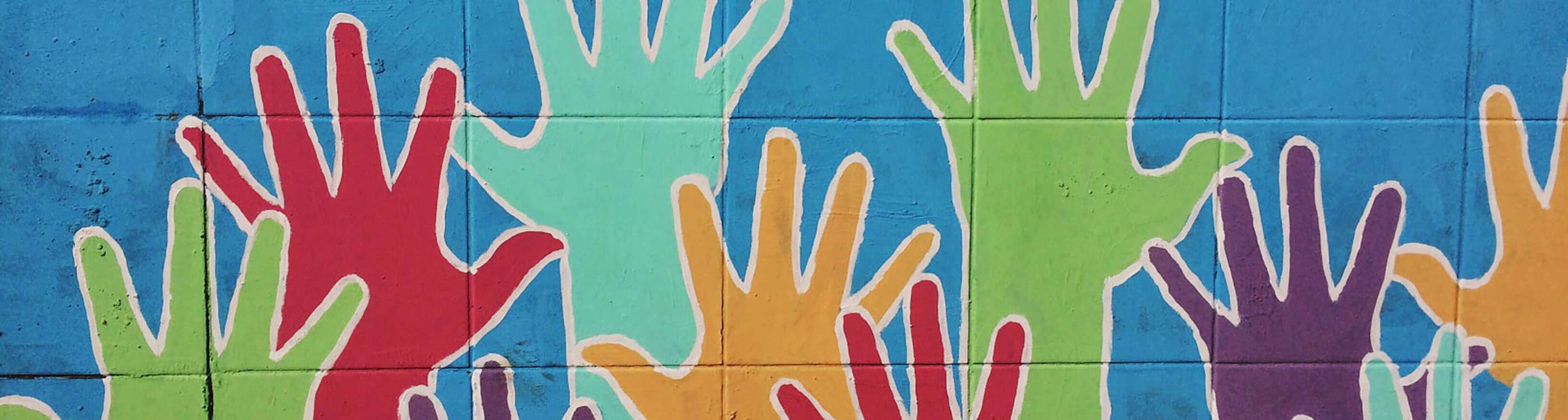 Mural of multi-colored hands raised